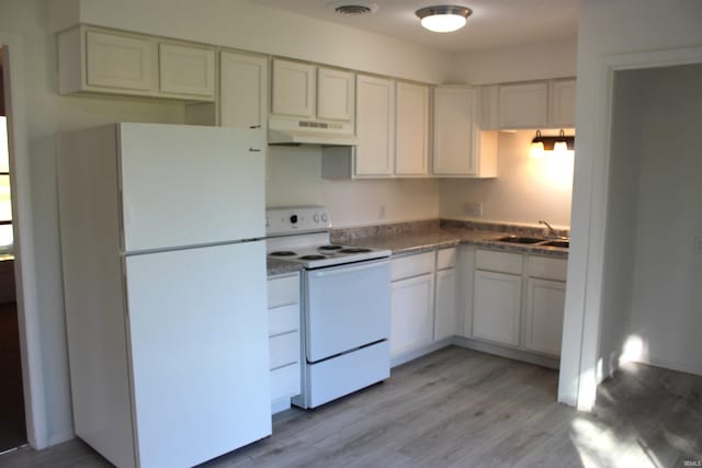 kitchen featuring white cabinets, light wood-type flooring, white appliances, and sink