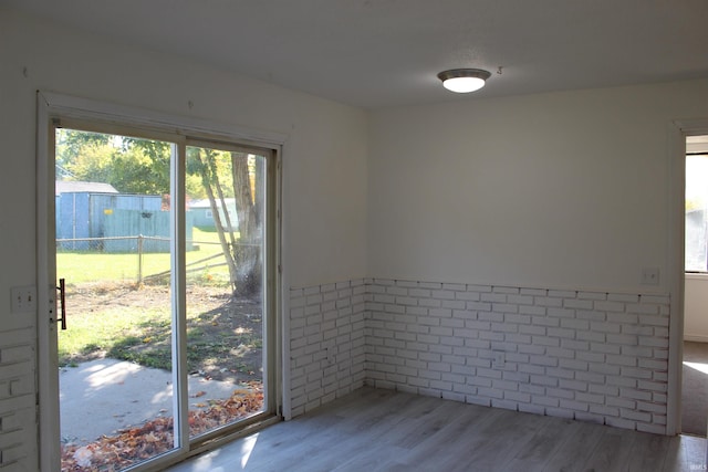 empty room with light hardwood / wood-style flooring