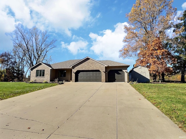 ranch-style house featuring a front lawn and a garage