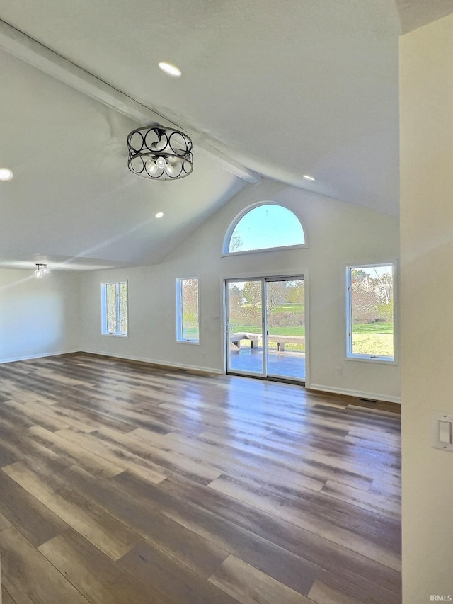 unfurnished living room featuring beam ceiling, hardwood / wood-style floors, and high vaulted ceiling