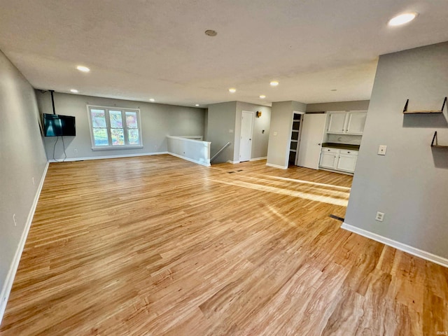 unfurnished living room featuring light hardwood / wood-style flooring