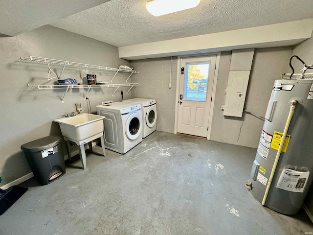 washroom with washer and dryer, laundry area, a sink, a textured ceiling, and electric water heater