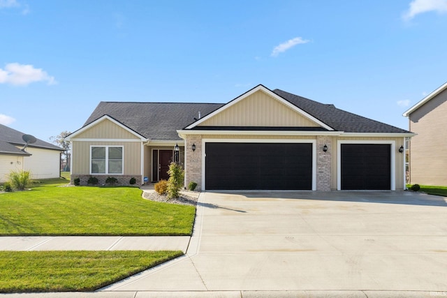 view of front of property featuring a garage and a front lawn