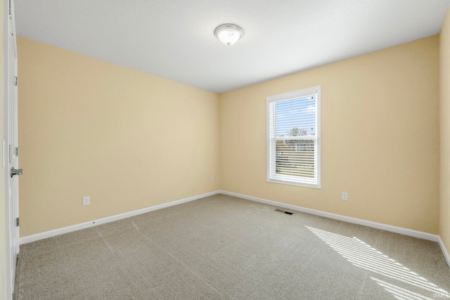 empty room with light colored carpet