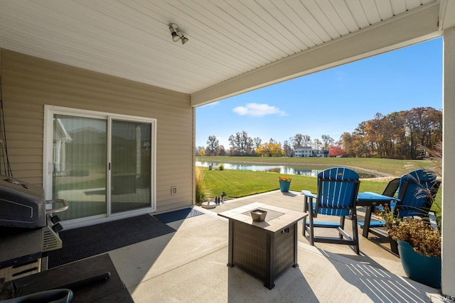 view of patio / terrace with outdoor lounge area and a water view