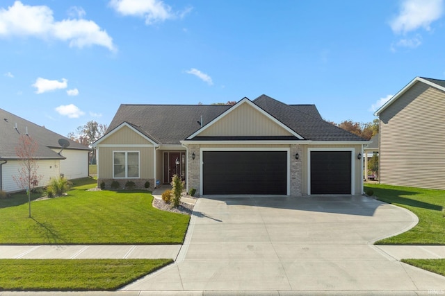 view of front of property with a front yard and a garage