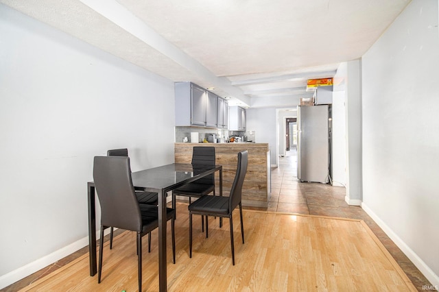 dining area with light hardwood / wood-style floors