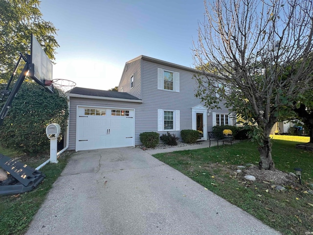 view of front of home with a garage and a front lawn