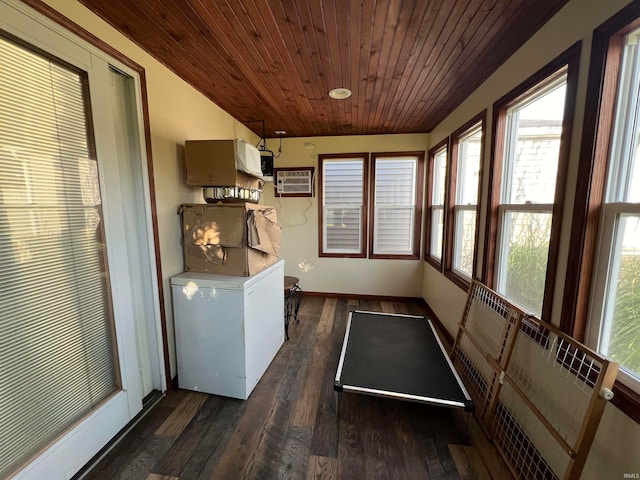 clothes washing area featuring a wall mounted air conditioner, wood ceiling, and dark hardwood / wood-style floors