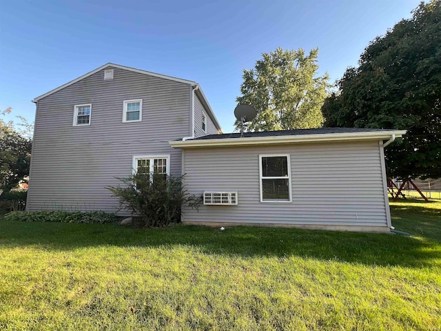 view of side of property featuring a yard