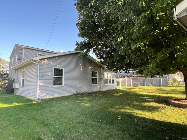 back of house featuring a yard