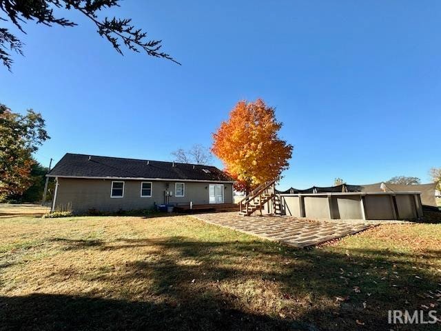 back of house with a yard