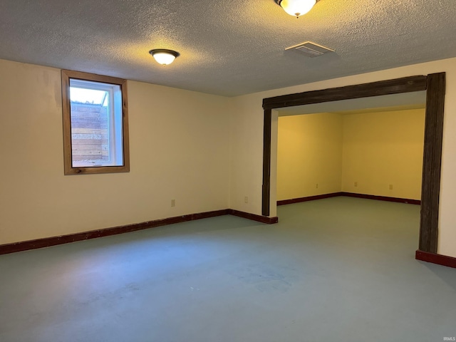 basement with a textured ceiling