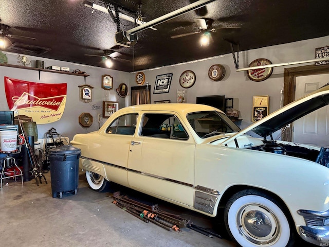 garage with ceiling fan and a garage door opener