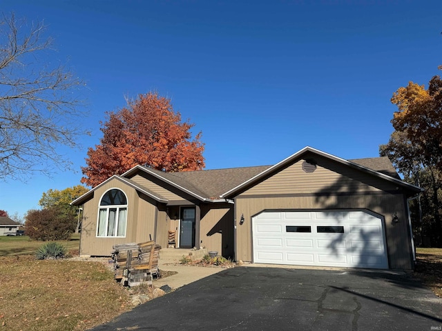 single story home featuring a garage