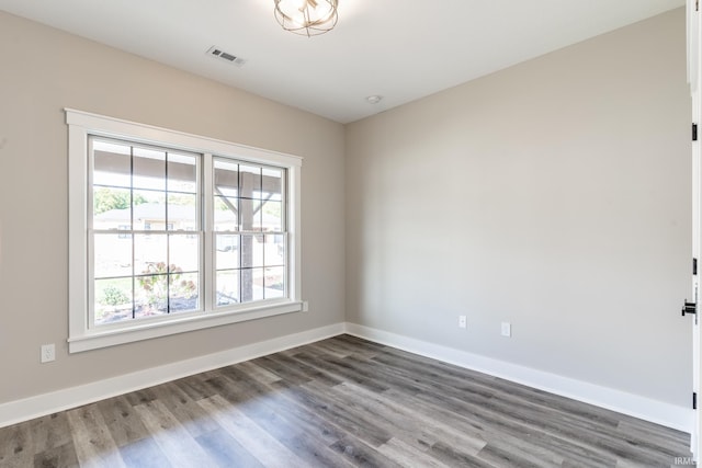 unfurnished room featuring hardwood / wood-style flooring