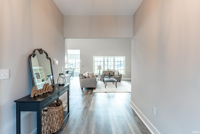 hall with hardwood / wood-style floors