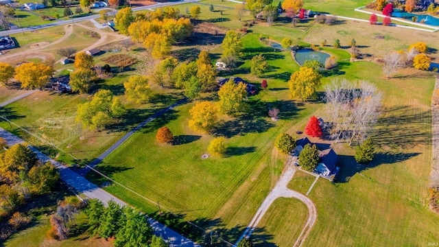 birds eye view of property with a rural view