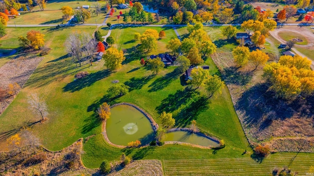 drone / aerial view featuring a water view and a rural view