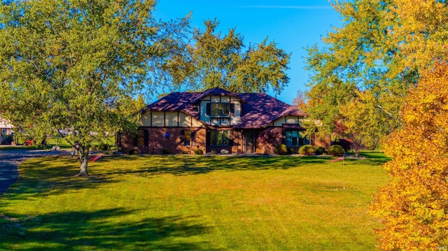 tudor house with a front yard