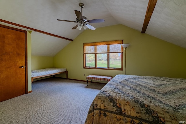 carpeted bedroom with vaulted ceiling and ceiling fan