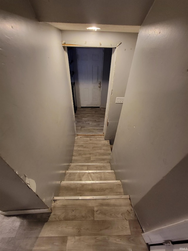 stairway featuring hardwood / wood-style flooring