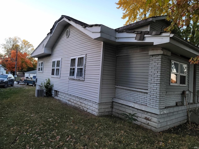 view of property exterior with a yard