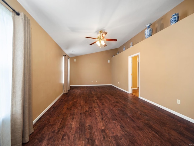 spare room with vaulted ceiling, wood-type flooring, and ceiling fan