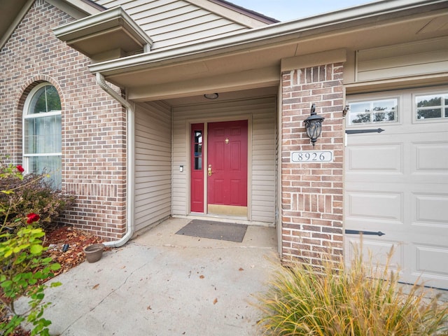 doorway to property featuring a garage