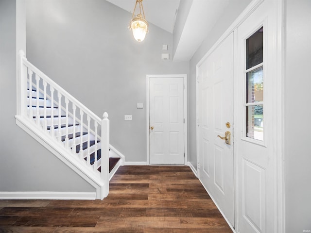 entryway featuring vaulted ceiling and dark hardwood / wood-style floors