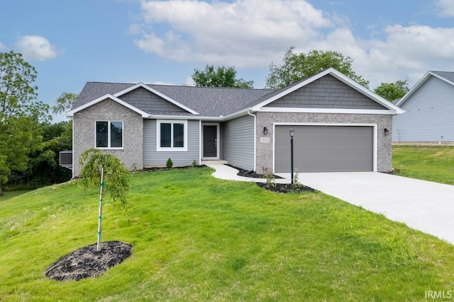 view of front of property with a front lawn and a garage