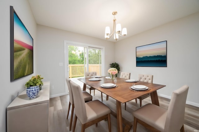 dining room featuring a notable chandelier and hardwood / wood-style floors