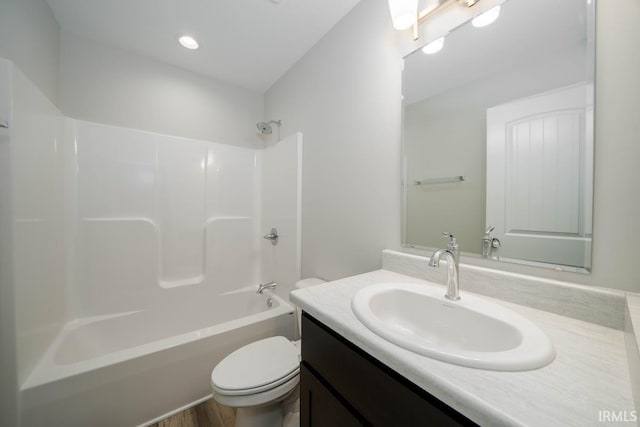 full bathroom with vanity, toilet, bathtub / shower combination, and wood-type flooring