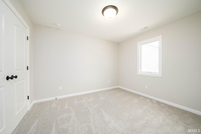 empty room featuring carpet