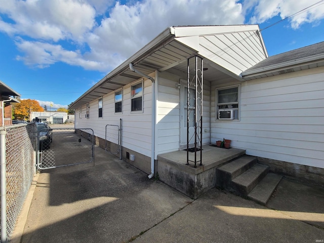 view of side of property featuring cooling unit