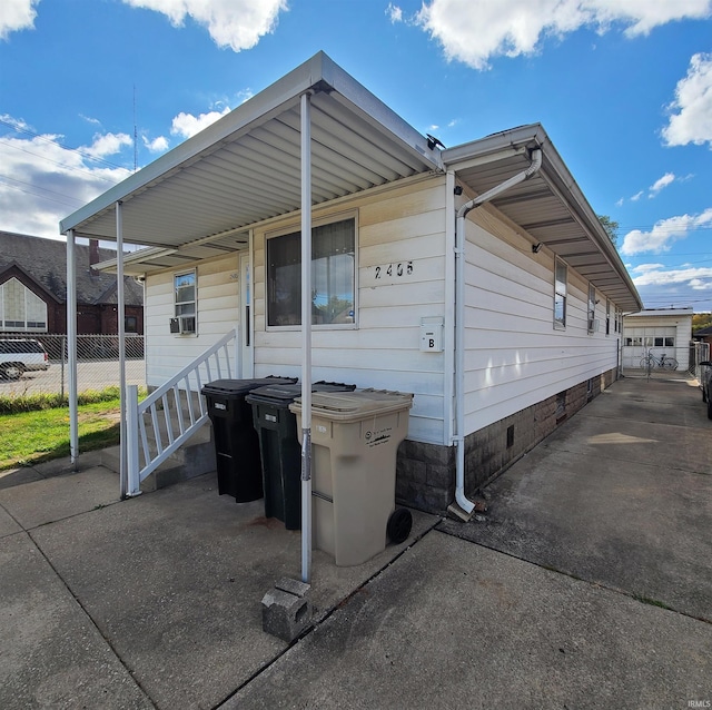 view of home's exterior featuring a carport