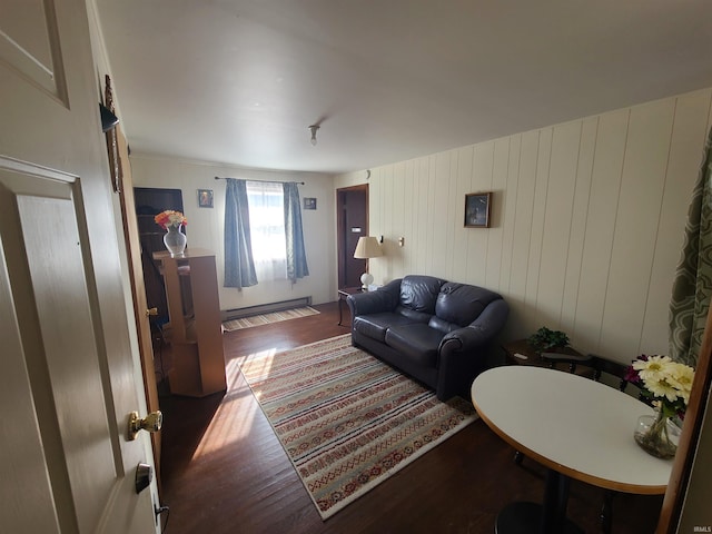 living room with wood walls and dark wood-type flooring