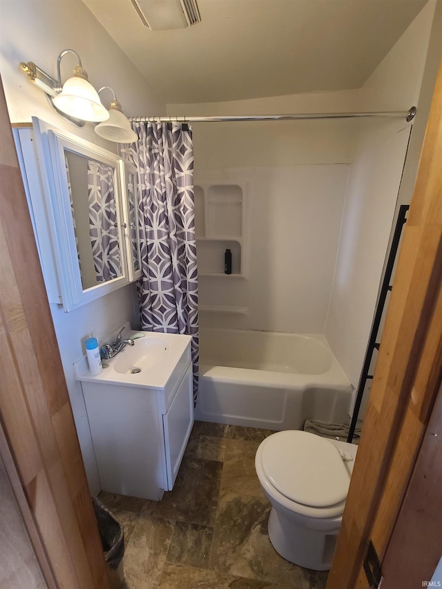 full bathroom featuring vanity, toilet, and shower / bathtub combination with curtain