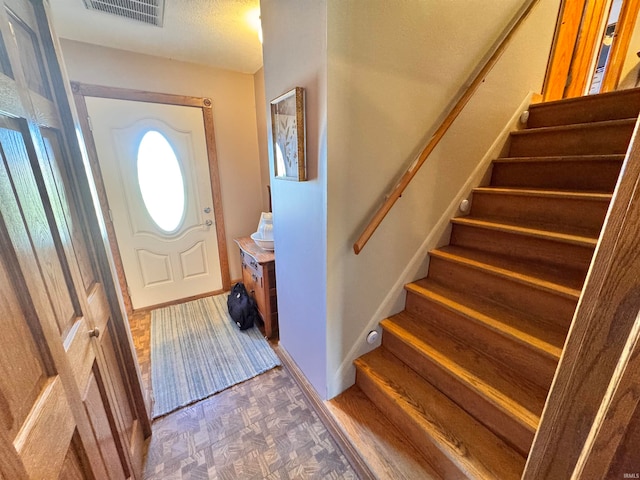 foyer entrance with wood-type flooring