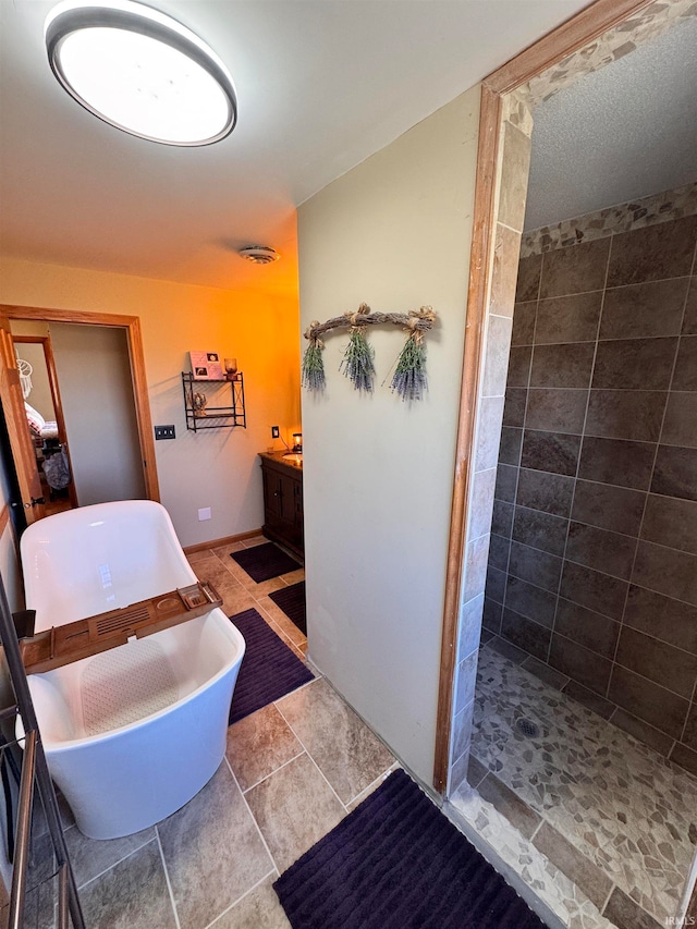 bathroom with vanity, independent shower and bath, and tile patterned flooring