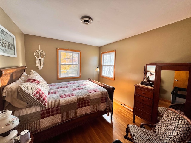 bedroom with wood-type flooring