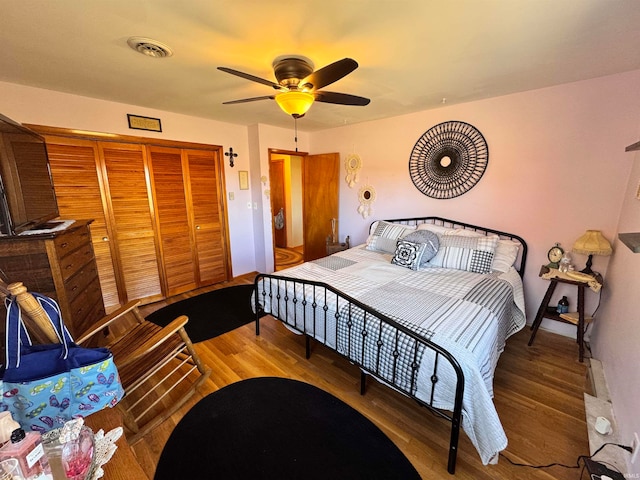 bedroom with hardwood / wood-style flooring and ceiling fan