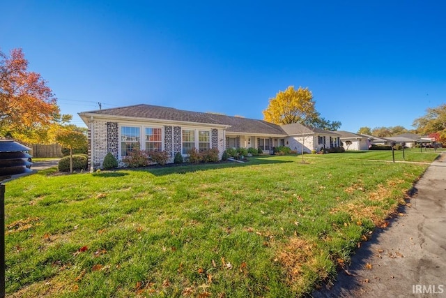 ranch-style house with a front yard