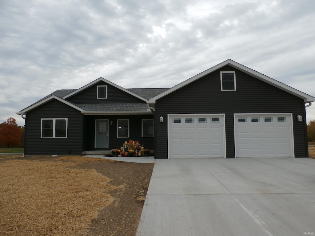 single story home featuring a garage