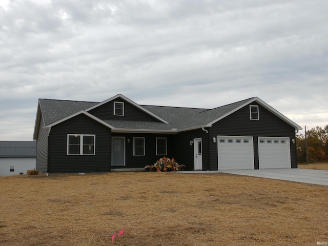 ranch-style house with a garage and a front lawn