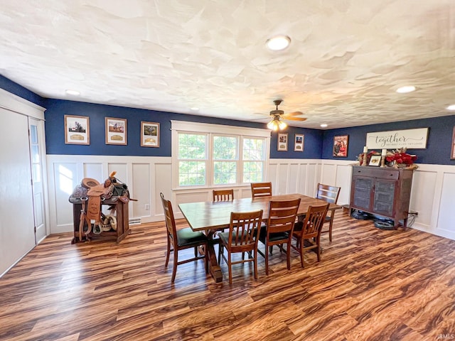 dining area featuring a textured ceiling, hardwood / wood-style floors, and ceiling fan