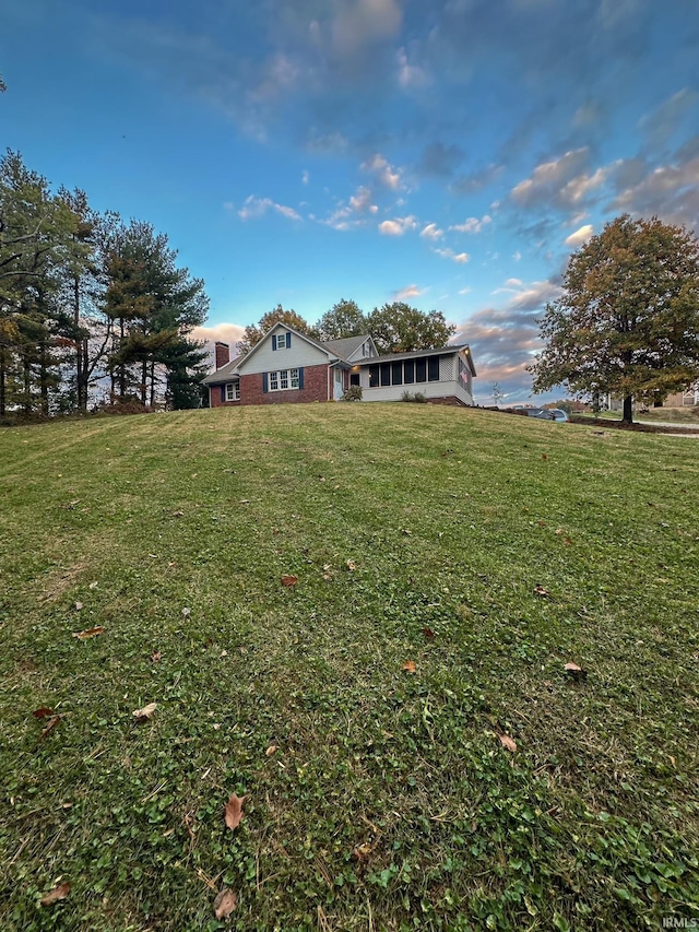 view of yard with a sunroom