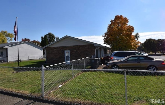 view of home's exterior featuring a yard