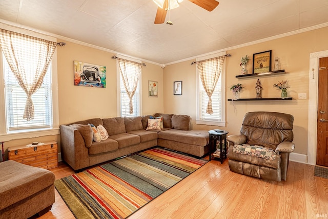 living room with ceiling fan, wood-type flooring, and ornamental molding