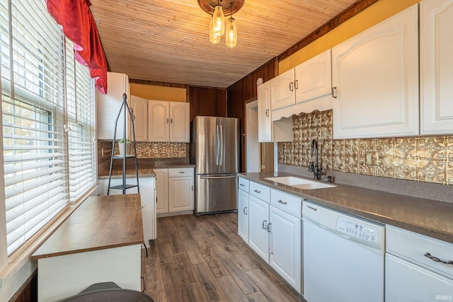 kitchen featuring stainless steel fridge, white cabinetry, white dishwasher, dark wood-type flooring, and sink